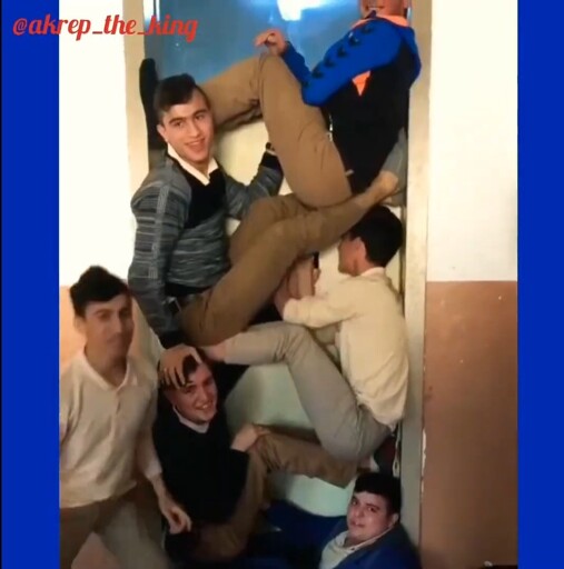 Highschoolers stacking themselves to cover the doorway like some kind of tetris.